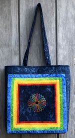 Quilted 6-color tote with embroidery on the front panel.