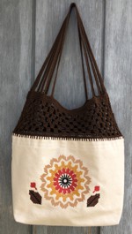 Canvas bag decorated with embroidery and crocheted top part
