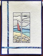 A small wall quilt with seascape one-color embroidery colored with inktense blocks
