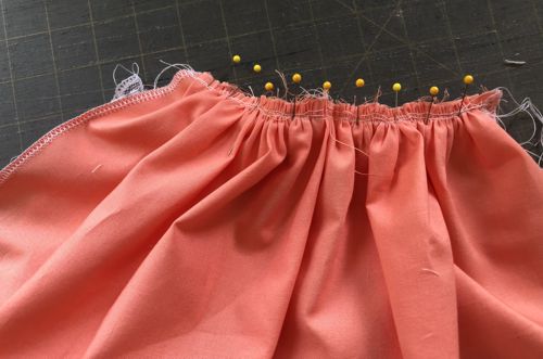 Photo showing how to attach the back part of the skirt to the bodice. View from the side of the skirt