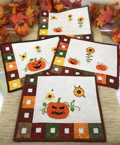 4 placemats in Fall colors with embroidered sunflowers and Jack-O-Lanterns,