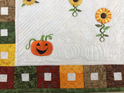 A close-up of the embroidery and quilting stitches on one of the placemats.