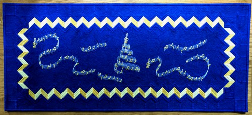 Roayl blue tablerunner with embroidered music notes