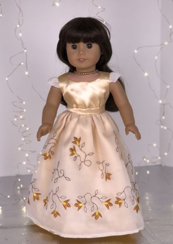 Finished outfit on a doll. Ready for a ball.