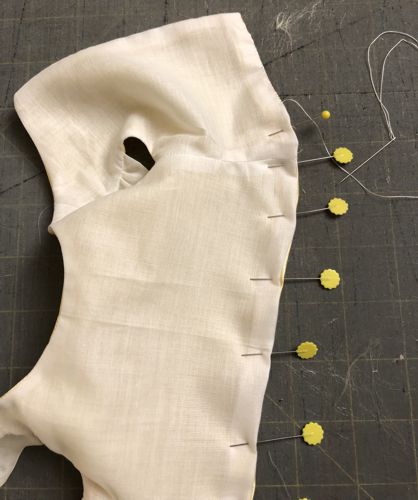 Finish the hem by hand.