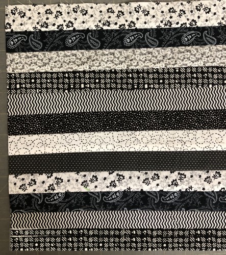 The black-and-white strips sewn lengthwise together.