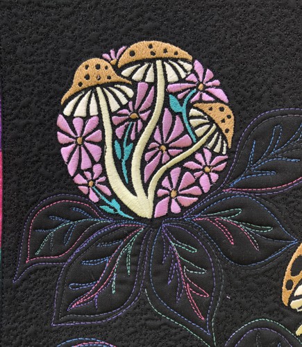 A close-up of the embroidery and quilting stitches.