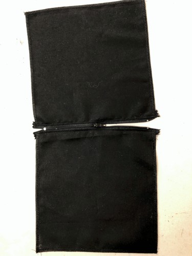 A zipper sewn between 2 squares.