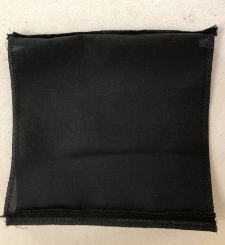 The pocket with attached zipper and stitched bottom.