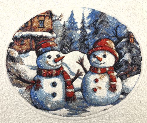 A close-up of the embroidery of 2 snowmen.