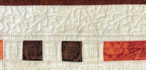 A close up of Fall Window quilting stitches.