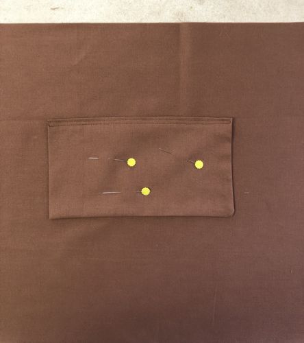 A pocket pinned onto the lining.